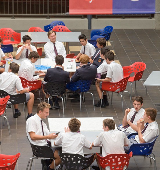 Students sit in the Brighton grammar Senior School Atrium at Lunch time