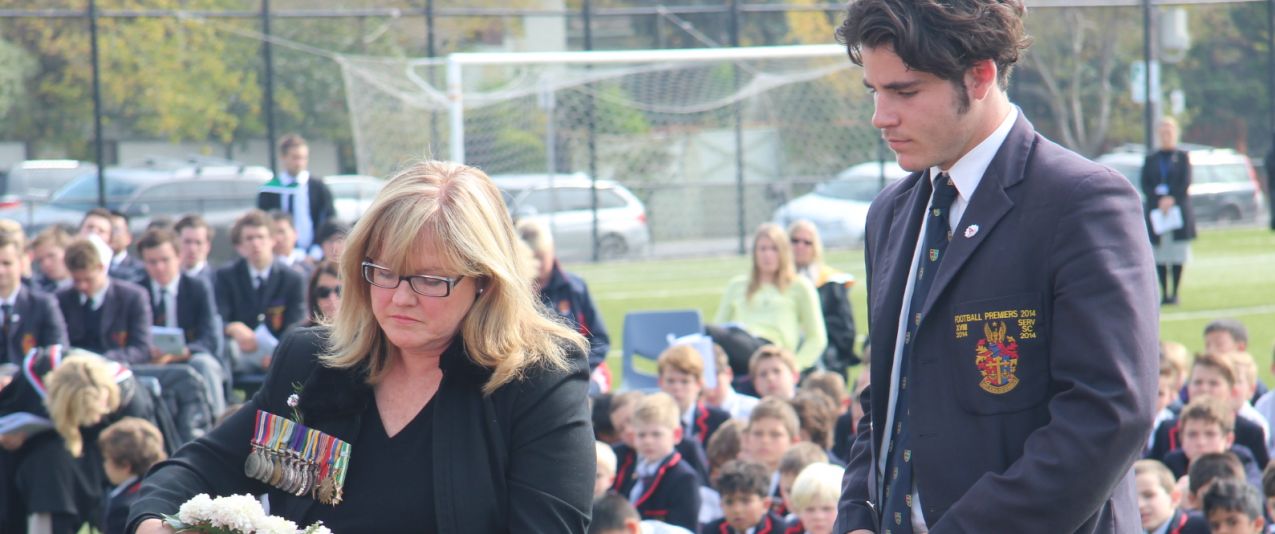 Susan Middlemiss places wreath at 2015 100-year anniversary ANZAC Service at top Boys Private School, Brighton grammar