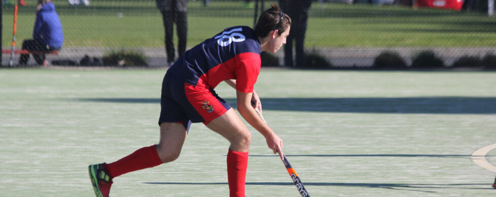 Brighton Grammar boy plays Hockey against Wesley College in APS competition