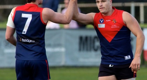 Ollie Cavallaro (OB 2012) high fives team mate while playing for the Old Brighton Grammar School Footy Team