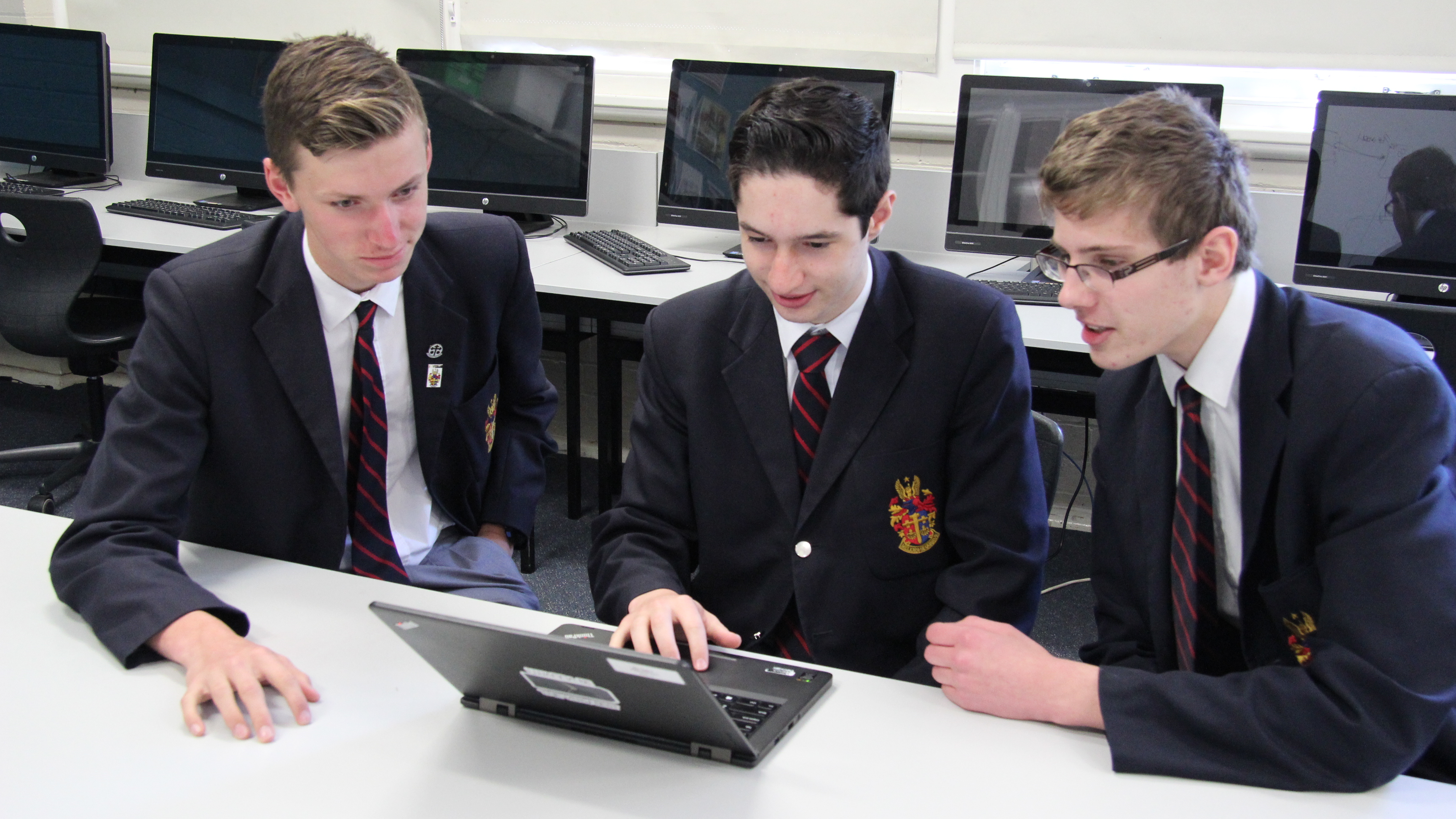 Boys working on computers